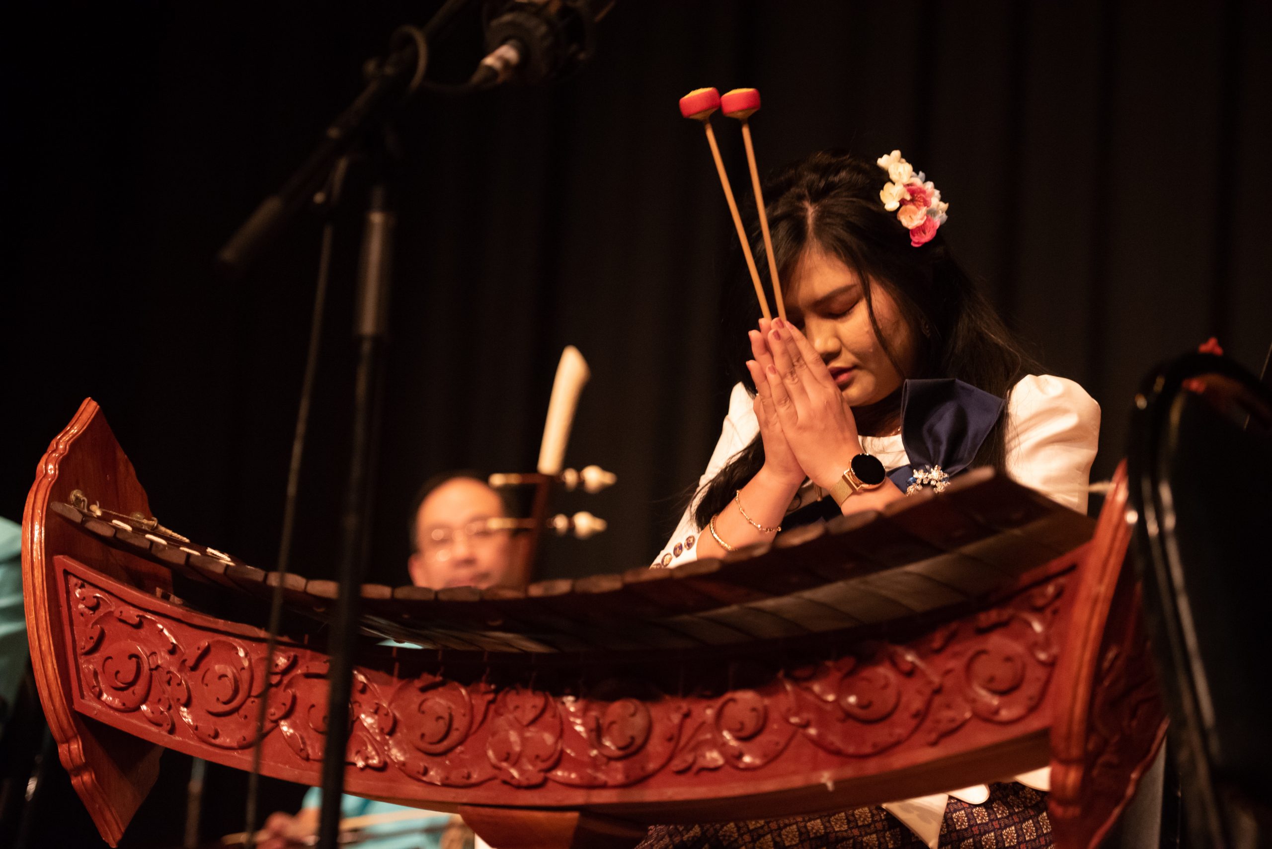 Asian women praying with instrument mallets praying